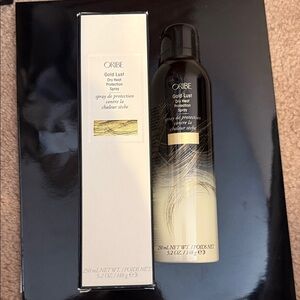 Oribe Gold Lust Dry Heat Protection Spray - Black and Cream with Gold Accents